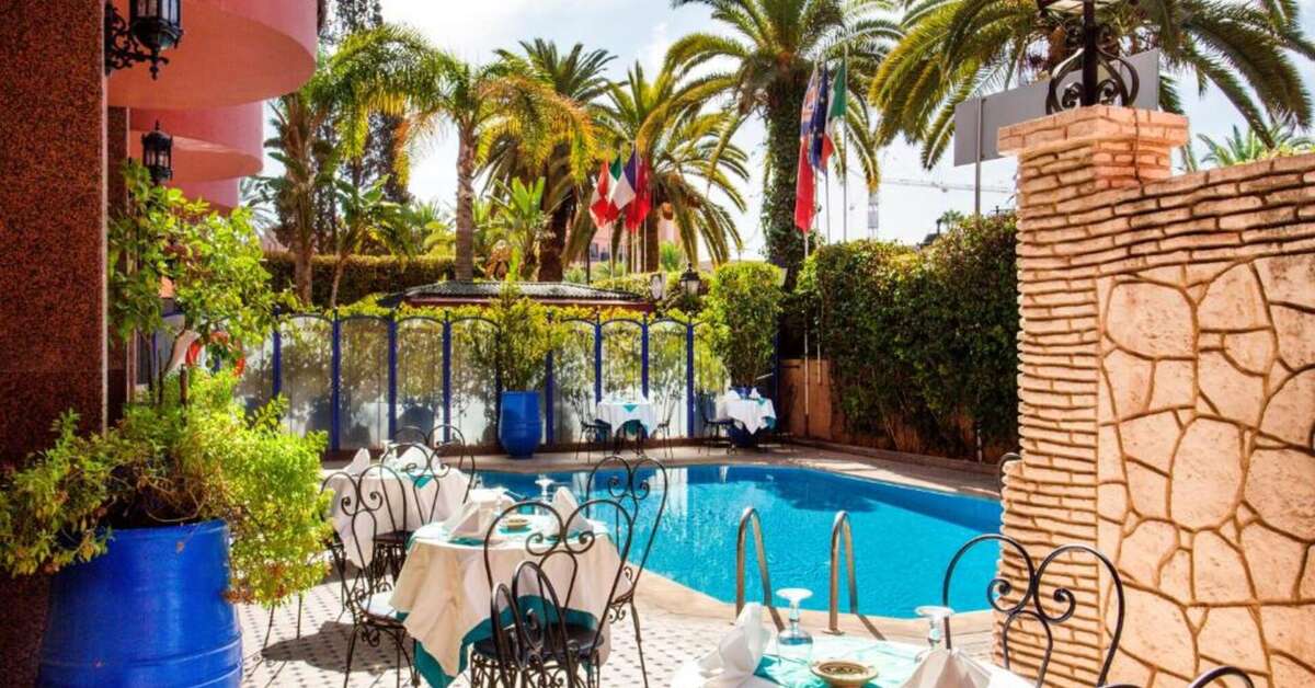 Zwembadzijde bij Akabar Hotel Marrakech, Marokko foto 2