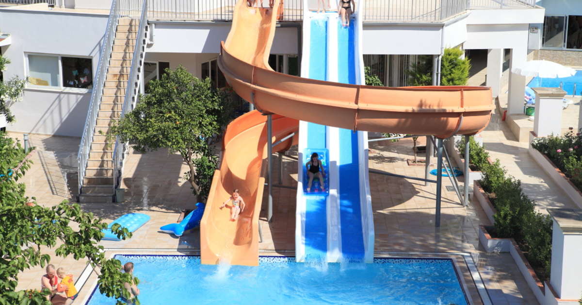 Zwembad met glijbanen van Catty Cats Garden Hotel Side, Turkije foto 3