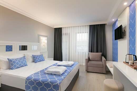 Hotelkamer in Euphoria Palm Beach Hotel in Kizilagaç, Turkije foto 3