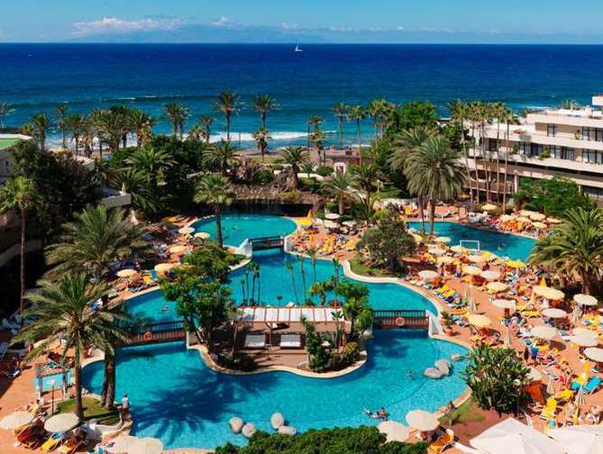 Zwembad van H10 Conquistador Hotel in Playa de las Américas, Spanje foto 1