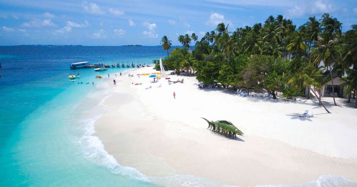 Zee en strand bij het Malahini Kuda Bandos Hotel Kuda Bandos, Malediven foto 2