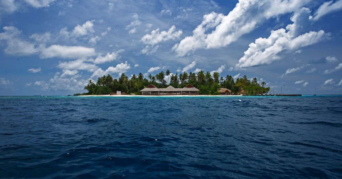 Zee en strand bij het Malahini Kuda Bandos Hotel Kuda Bandos, Malediven foto 3